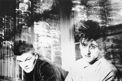 Two people seated by windows for a portrait