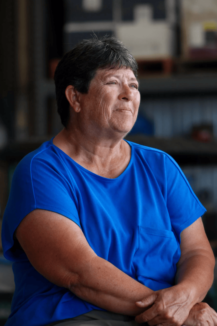 A woman sits for a photo