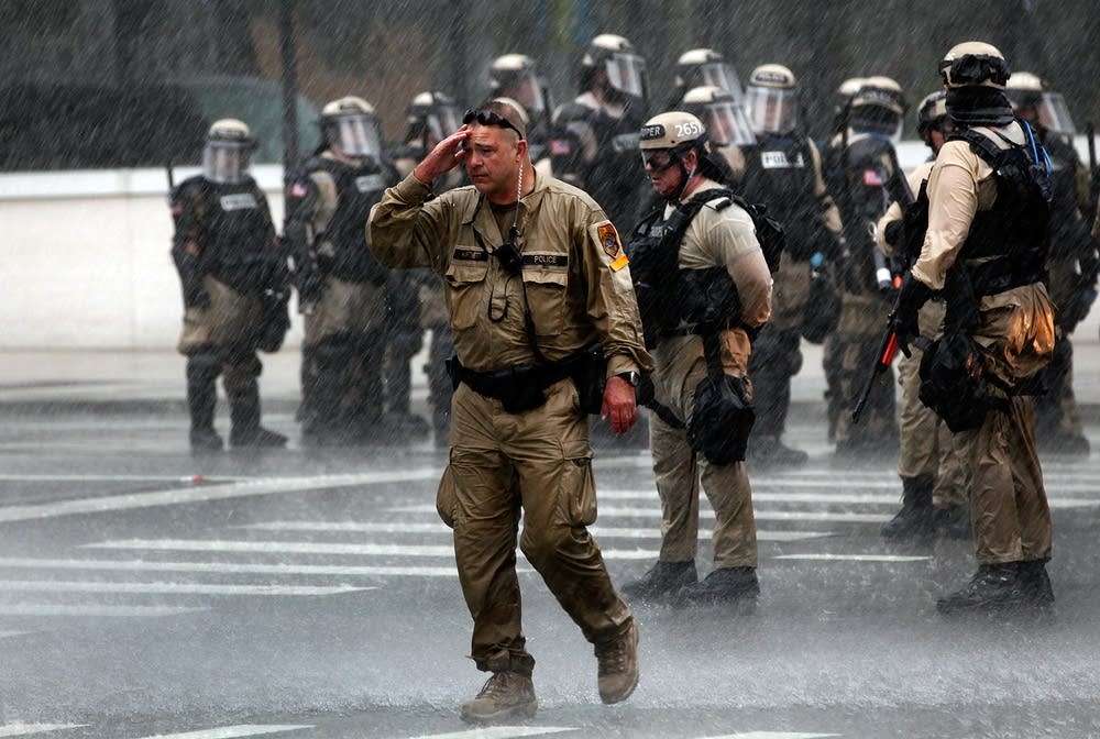 Rain-soaked officers