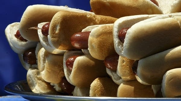 A plate of hot dogs sit on a table at a hot dog-eating contest in Coney Island. 
