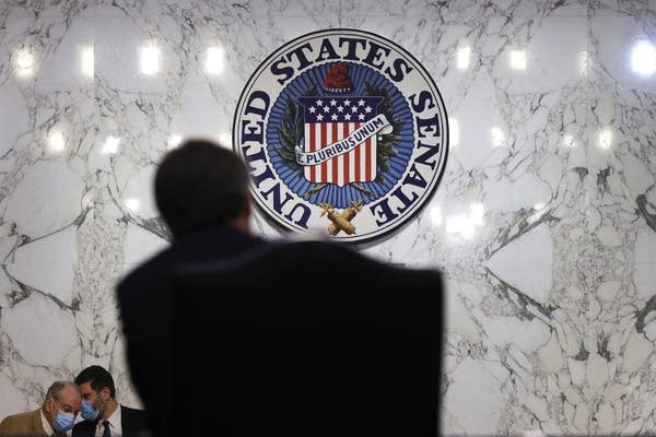 WASHINGTON, DC - MARCH 02: Committee ranking member Sen. Chuck Grassley (R-IA) (L) listens to an aide as FBI Director Christopher Wray testifies during a hearing before Senate Judiciary Committee at Hart Senate Office Building on March 2, 2021 on Capitol Hill in Washington, DC. The committee held a hearing on “Oversight of the Federal Bureau of Investigation: the January 6 Insurrection, Domestic Terrorism, and Other Threats.”