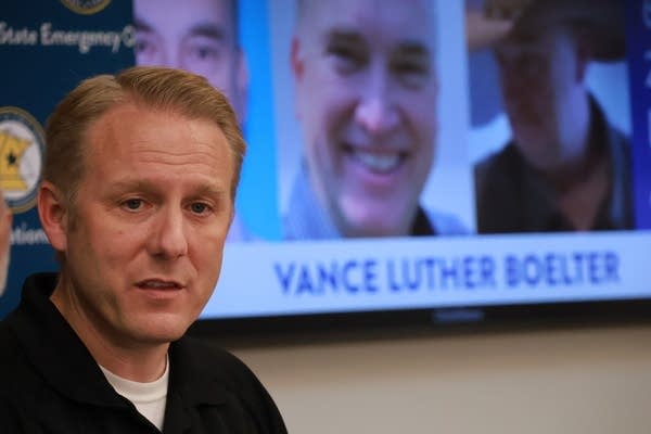 A man speaks in front of a visual prompter.