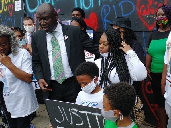 An attorney and family members of Calvin Horton at a press conference.