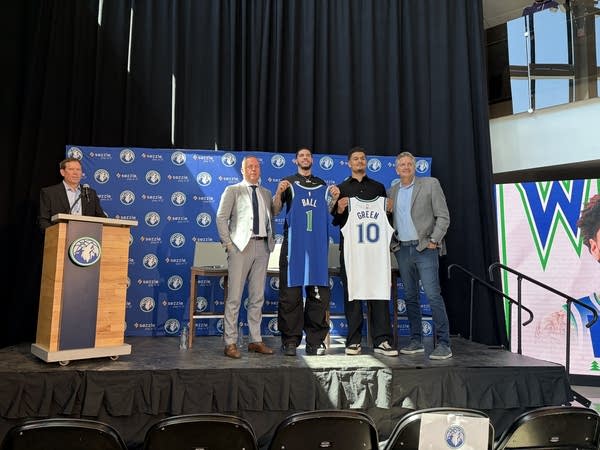 LaMelo Ball and Josh Green holding their jerseys