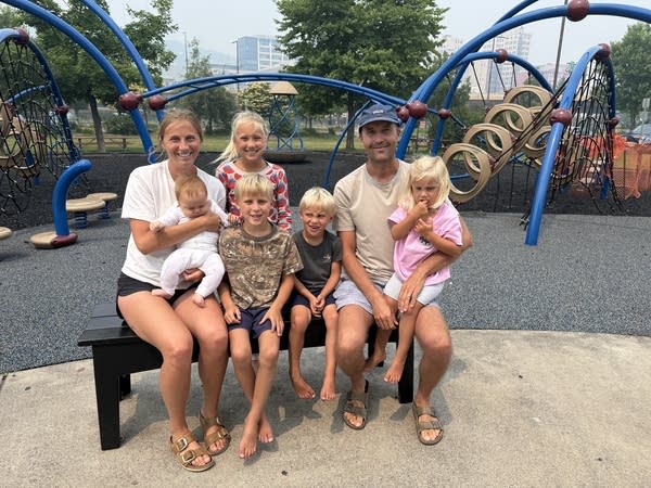 Family posing for photo at playground in Duluth