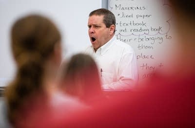 A man yawns. 