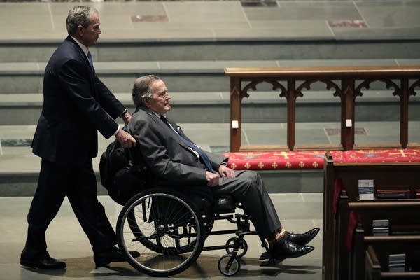 Former Presidents George W. Bush, left, and George H.W. Bush.