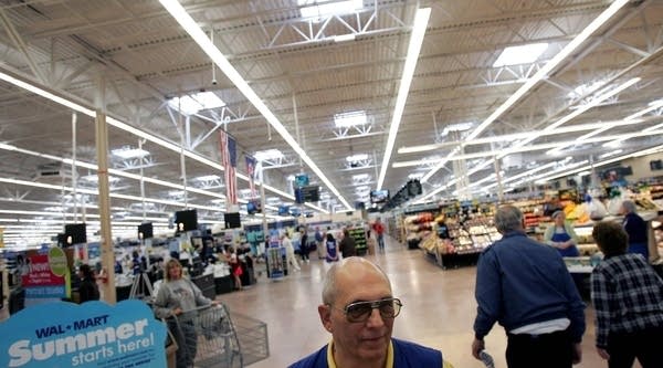 A Wal-Mart greeter is seen welcoming customers in Bowling Green, Ohio. Walmart stores will say goodbye to their greeters on the overnight shift in a cost-cutting measure.