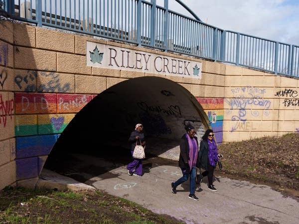 a tunnel with a sign that reads "Riley Creek"