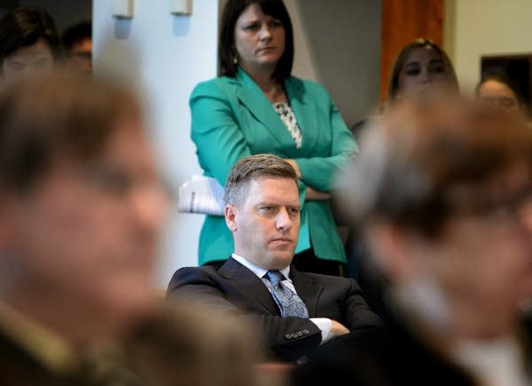 Kurt Daudt and Joyce Peppin listen.