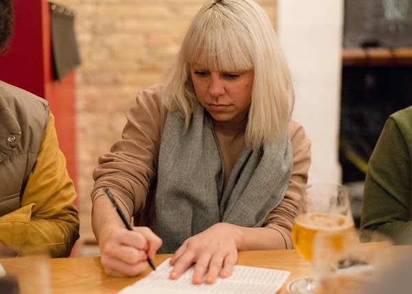 Bobbi Barron practices writing in cursive during a meet-up.