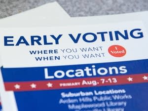 An early voting pamphlet sits on a table.