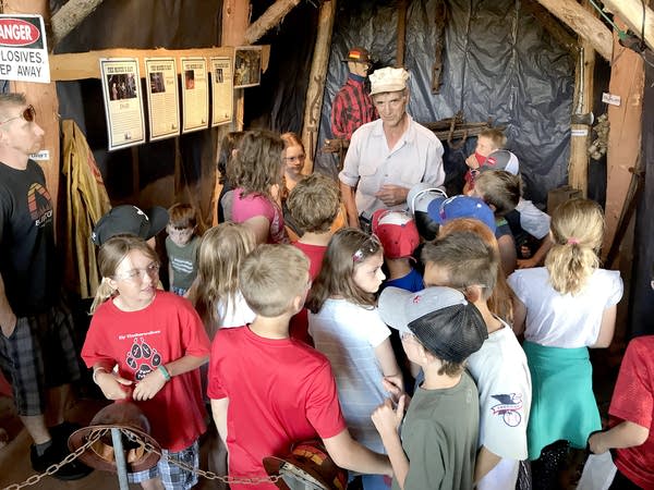 A man talks to students at Pioneer Mine 