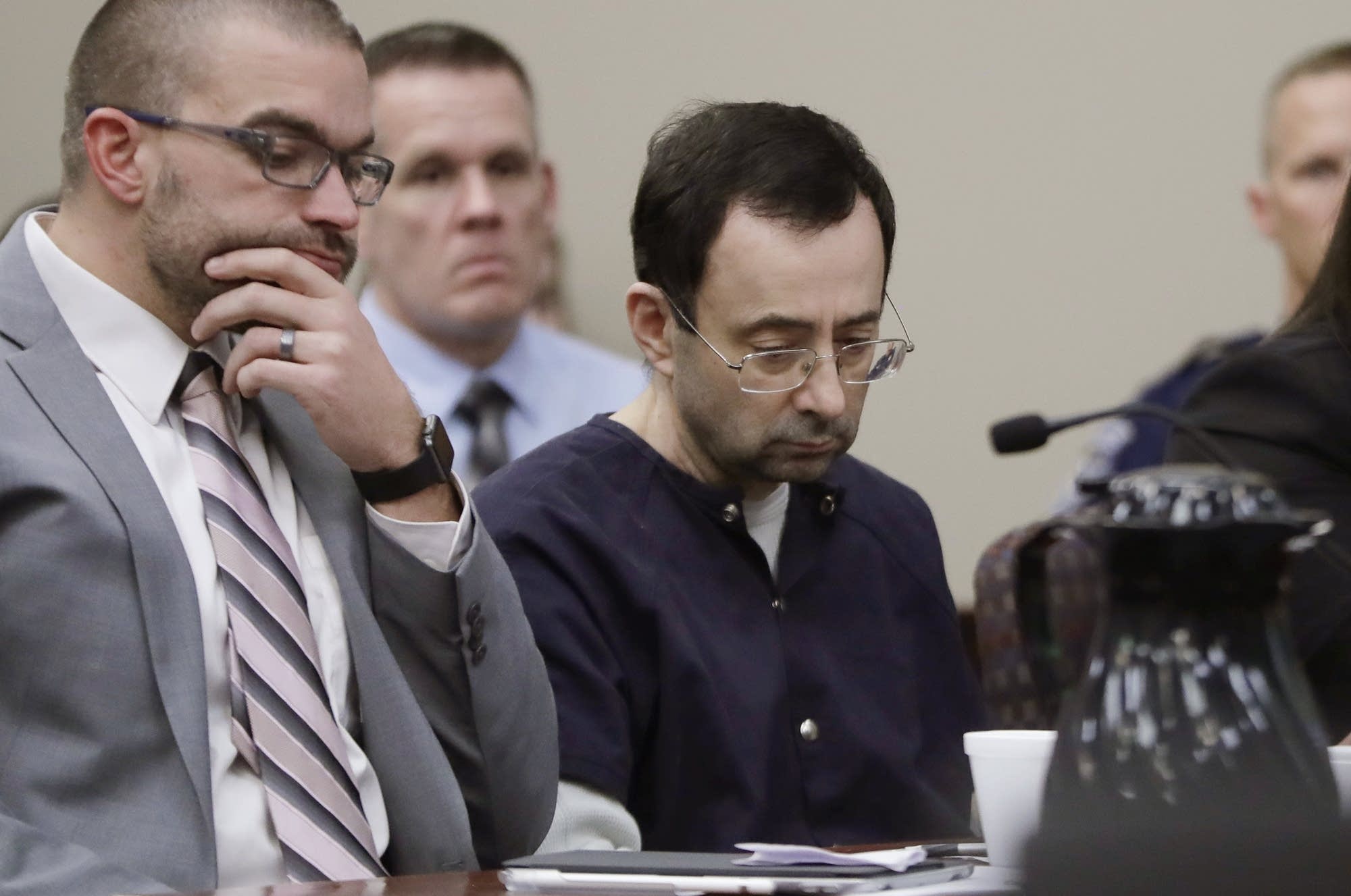 Larry Nassar sits with an attorney during his sentencing hearing.