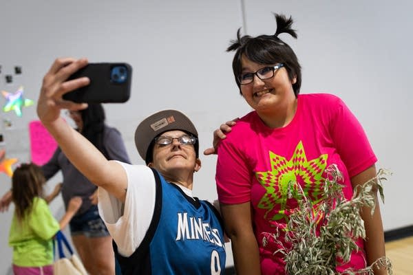 Two people pose for a selfie