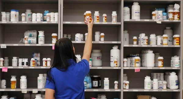 MIDVALE, UT - SEPTEMBER 10: A pharmacy technician grabs a bottle of drugs off a shelve at the central pharmacy of Intermountain Heathcare on September 10, 2018 in Midvale, Utah. IHC along with other hospitals and philanthropies are launching a nonprofit generic drug company called "Civica Rx" to help reduce cost and shortages of generic drugs.