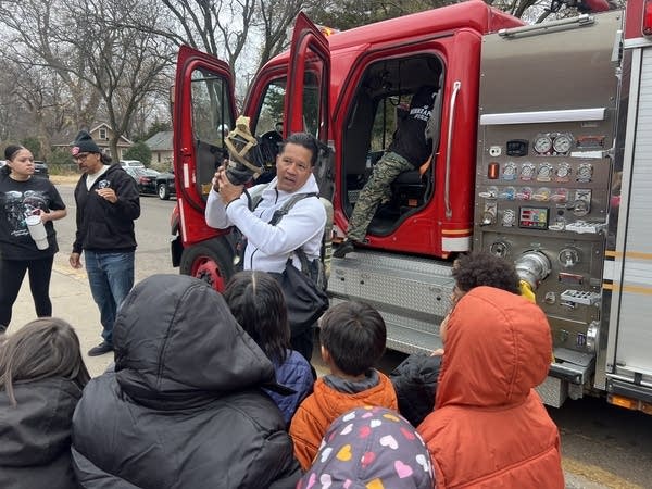 Firefighter giving demonstration 