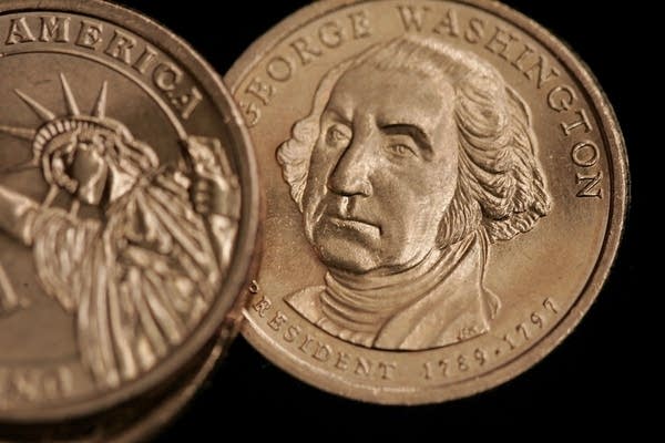 CHICAGO - JANUARY 24:  The United States Mint showcases the new Presidential series $1 coins, featuring the Statue of Liberty on the reverse, on January 24, 2007 in Chicago, Illinois.  