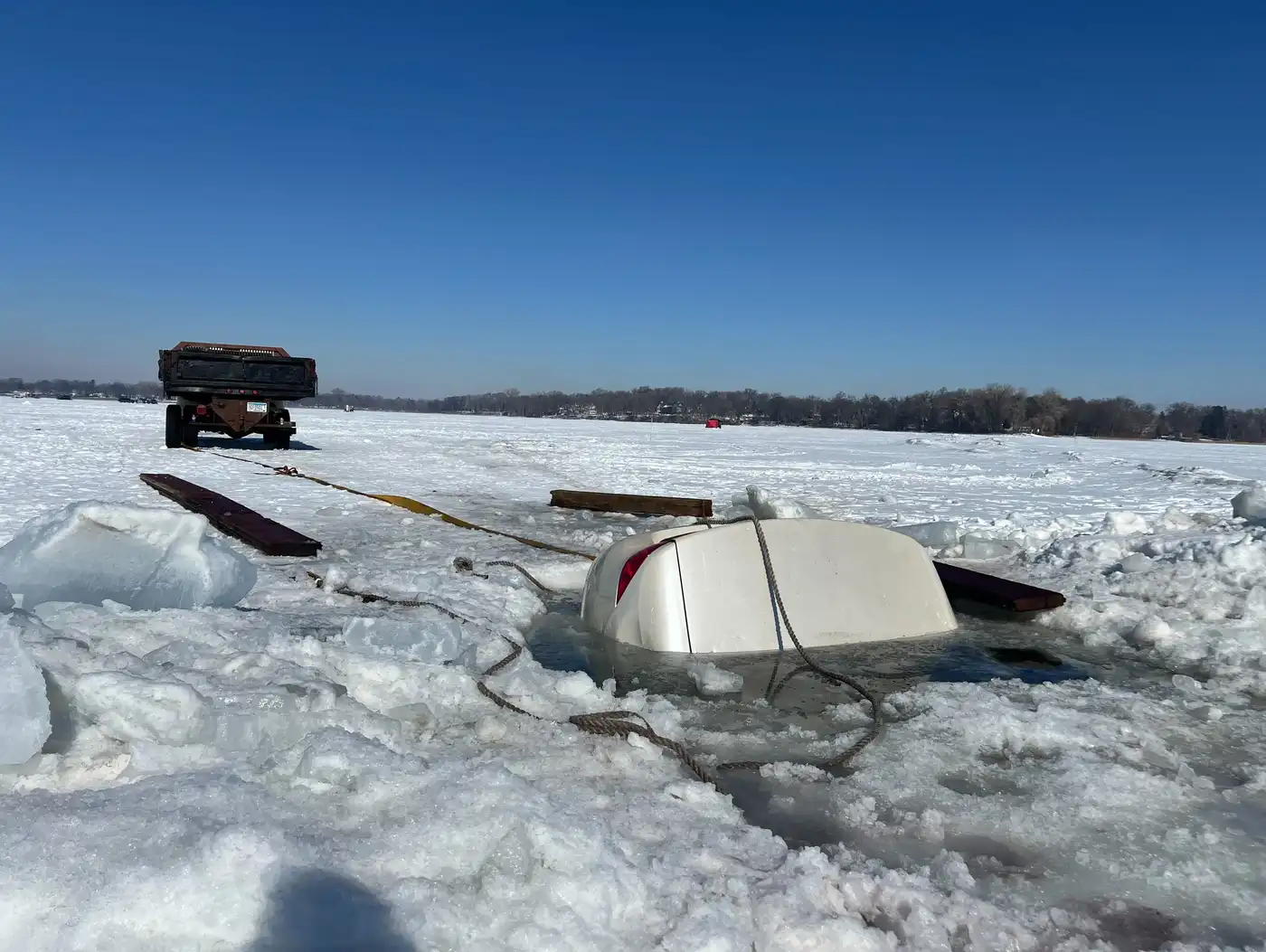 Sheriff: Owner of Buick half-submerged in White Bear Lake has a few days to  remove it | MPR News