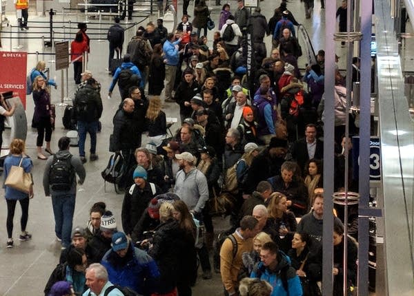 Long lines form at Minneapolis-St. Paul International Airport early Monday, Feb. 5, 2018, as Super Bowl visitors begin to leave.