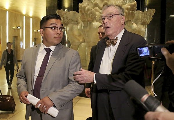 Jeronimo Yanez and attorney Tom Kelly leave the Ramsey Co. Courthouse.