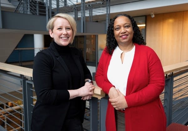 two women posing for a portrait