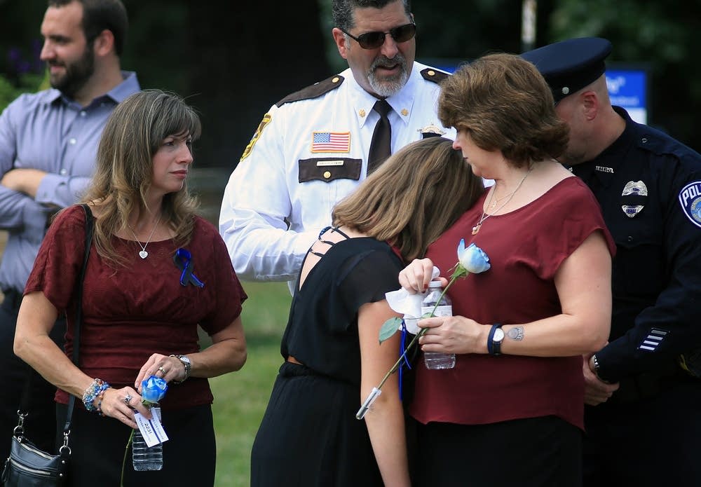 Patrick's wife, Michelle, comforts daughter Amy