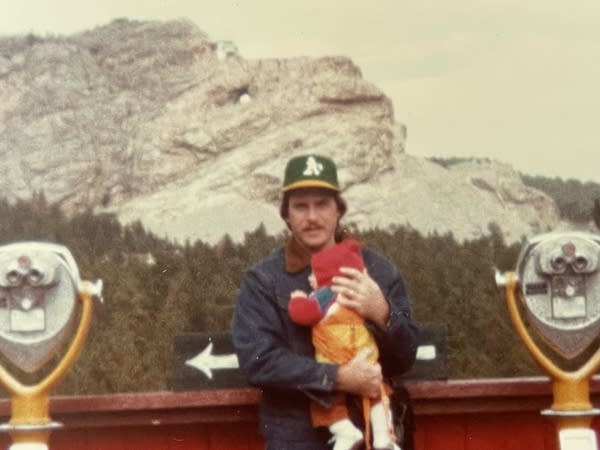 A man in front of the Crazy Horse Memorial