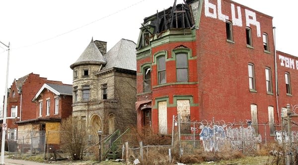 A row of abandoned buildings line a Detroit, Michigan street.