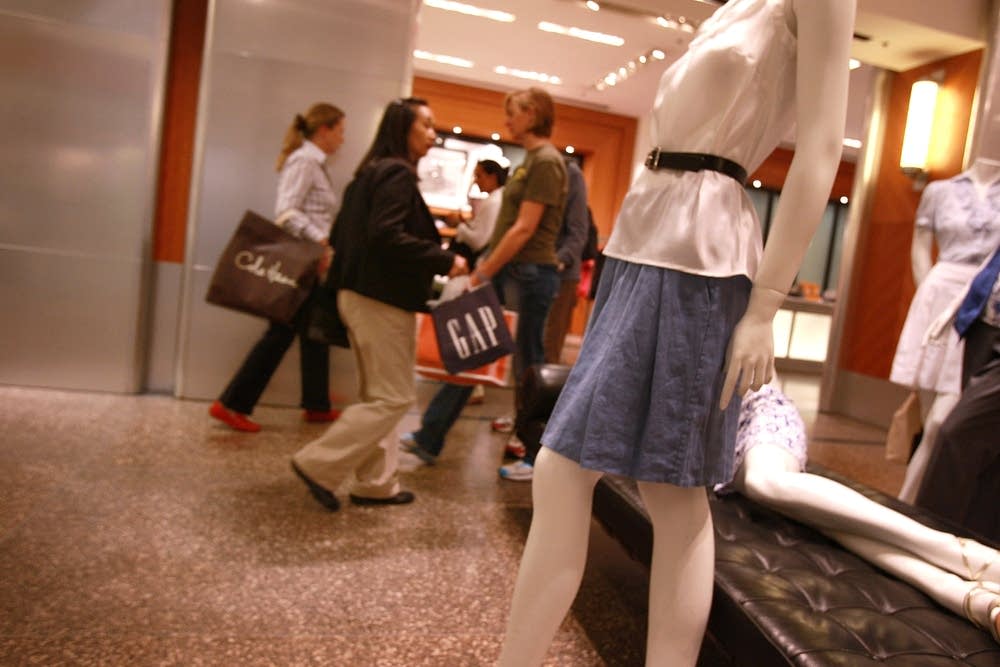 People walk through a store in New York City