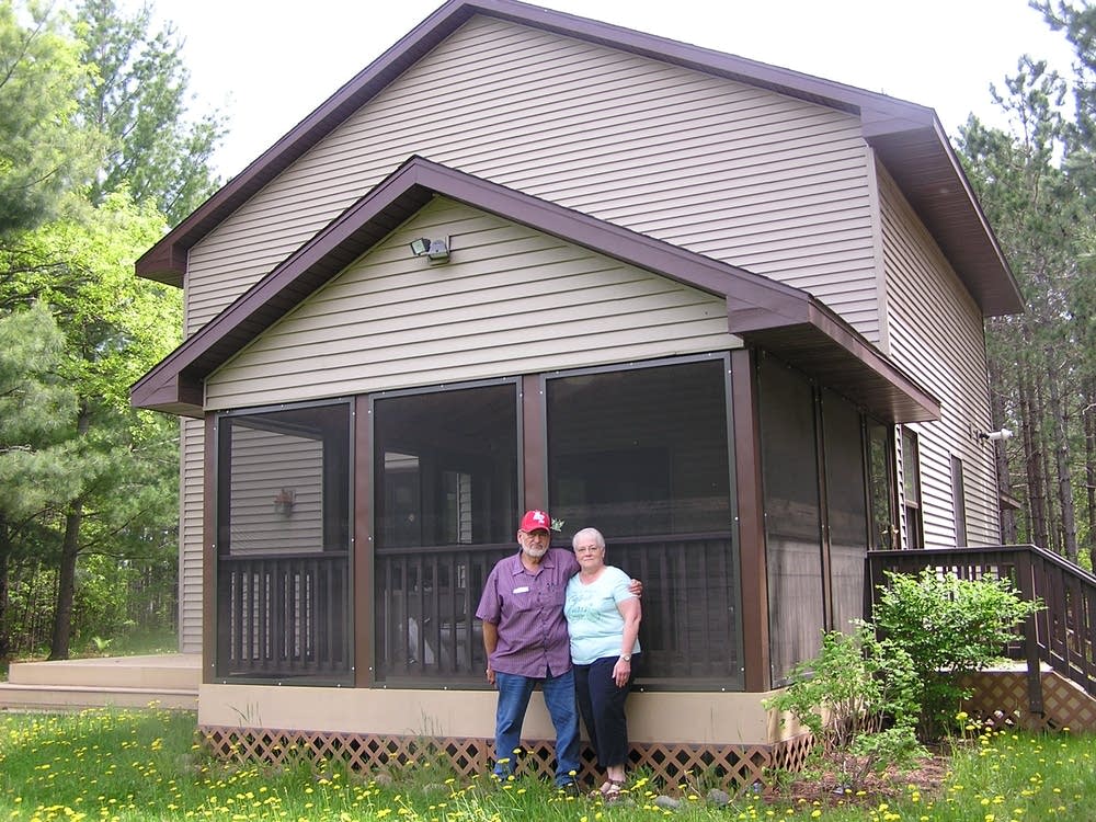 Bill and Shirley Klossner stand outside their home