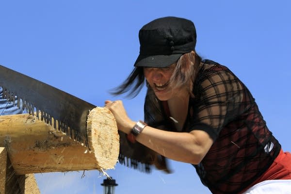 Autumn Pechan taking on the cross cut saw