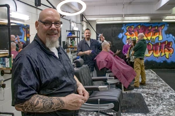 Man posing for photo in prison barber shop
