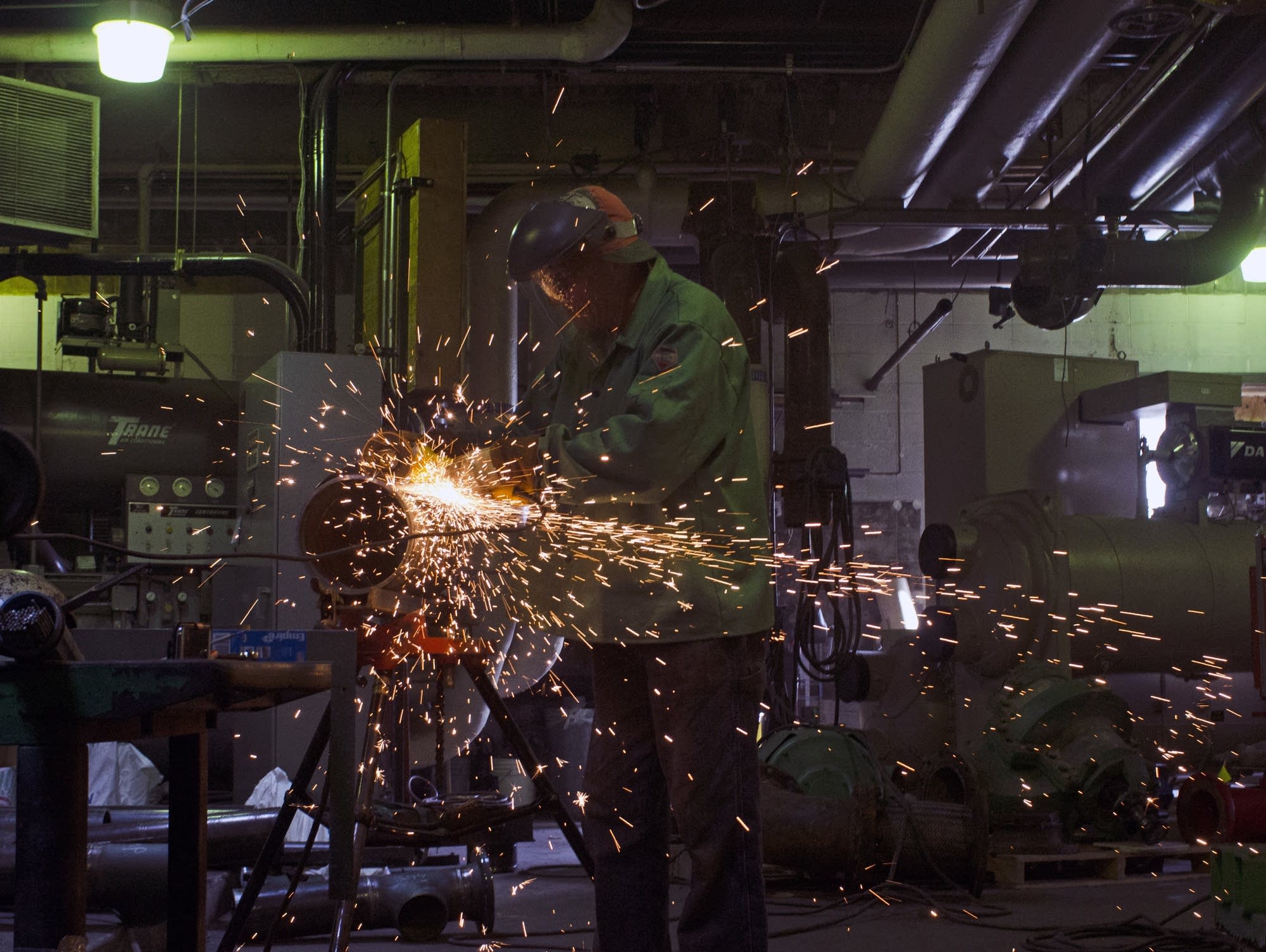 Jay Larson welds in the U.S. Bank boiler room.