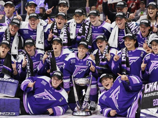 The Minnesota Frost pose for a team photo with the Walter Cup after winning the championship against Ottawa at the Xcel Energy Center in St. Paul on Monday, May 26, 2025.