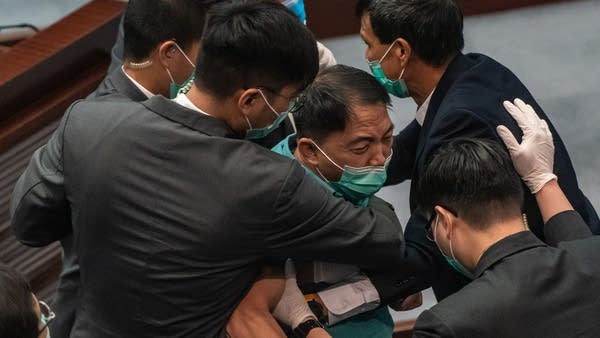 Pro-democracy lawmakers in Hong Kong object to an announcement from the National People's Congress that Beijing would enact national security legislation in the semi-autonomous territory.