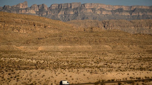 A car drives through Big Bend National Park, Texas. 