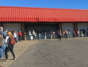 About 70 people waited in line at an early voting center.