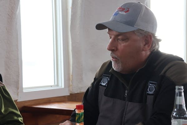 A man sits to chat inside the Igloo Bar.