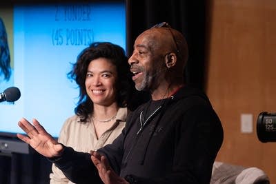 diane and derrick stevens speaking to audience