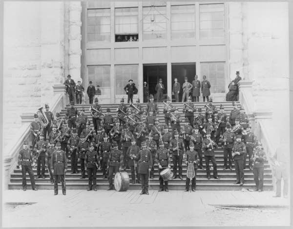 Black and white photo of a military band posing for photo