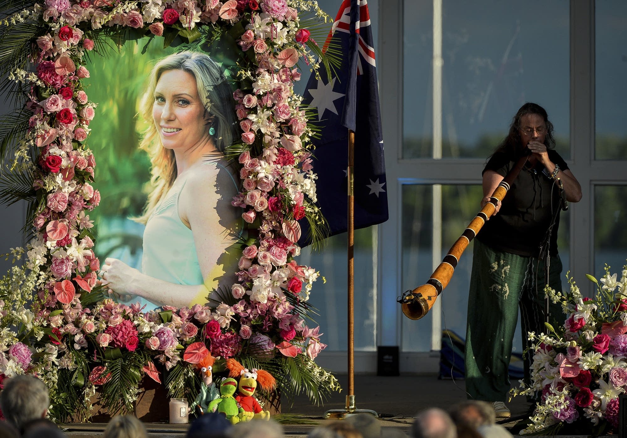 A memorial service for Justine Ruszczyk at Lake Harriet.