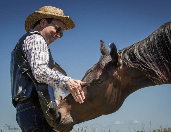 AJ Scheiber greets a horse