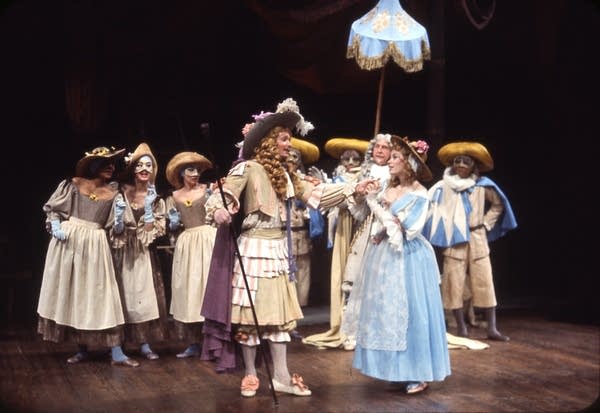 People stand on a stage and perform