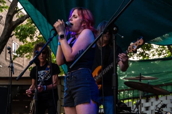 a band performing on an outdoor stage