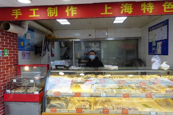 Chen Tailiang's bakery was opened during the Lunar New Year holiday because he was unable to go back to his hometown in eastern Jiangxi province due to restricted transportation across the country. (Jennifer Pak/Marketplace)