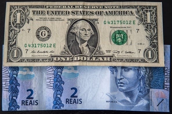 A U.S. dollar and Brazilian two real note.