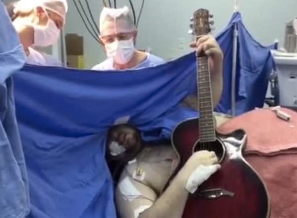 Today’s Music News: Man covers the Beatles during brain surgery