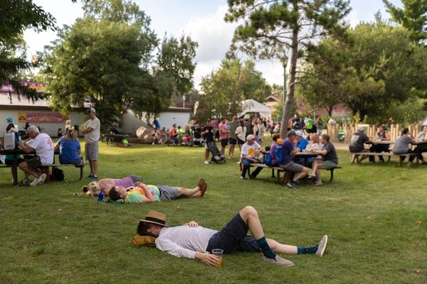 people resting on gross at the state fair