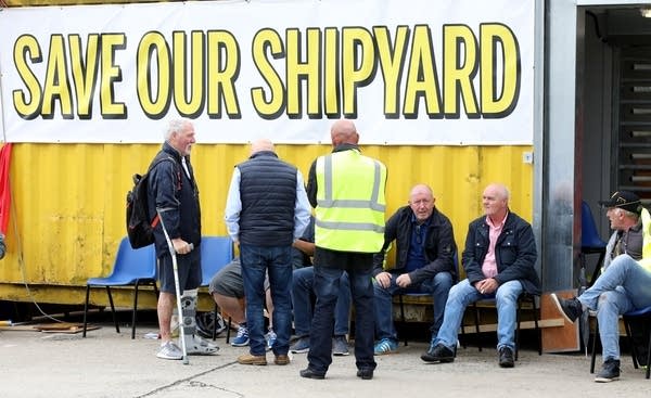 Harland and Wolff shipyard workers protest at the gates to the shipyard in Belfast on August 5, 2019. (Photo by PAUL FAITH / AFP)        (Photo credit should read PAUL FAITH/AFP/Getty Images)